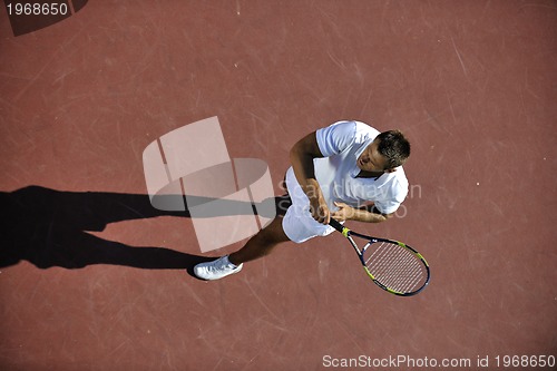 Image of young man play tennis