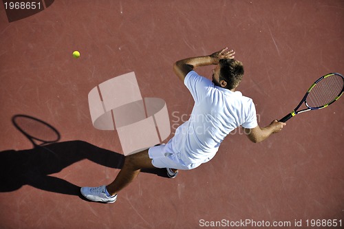 Image of young man play tennis