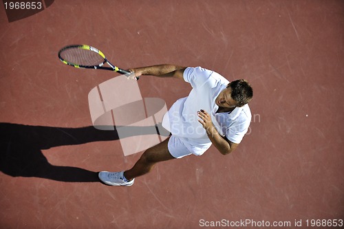 Image of young man play tennis