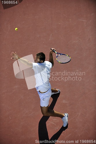 Image of young man play tennis