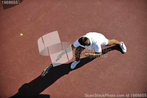 Image of young man play tennis