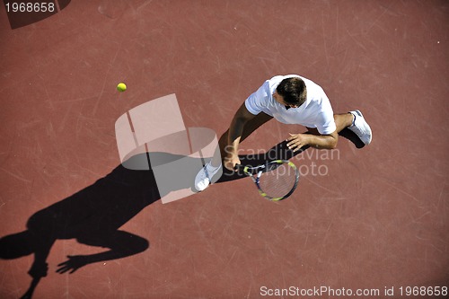 Image of young man play tennis
