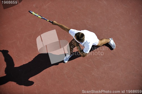 Image of young man play tennis