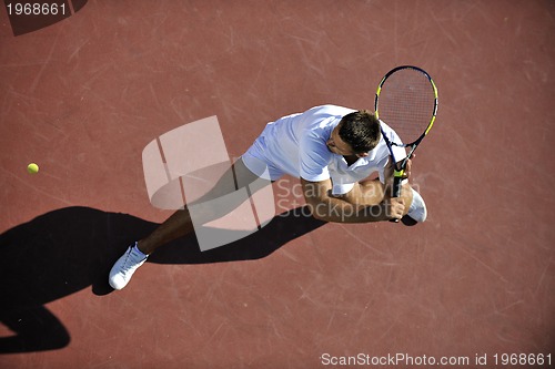 Image of young man play tennis