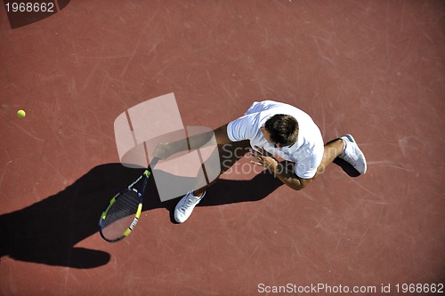 Image of young man play tennis