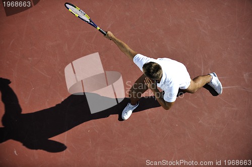 Image of young man play tennis