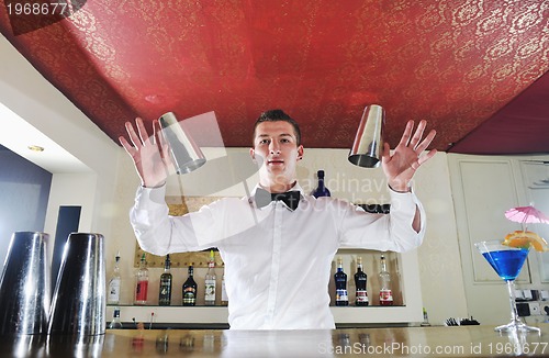 Image of pro barman prepare coctail drink on party