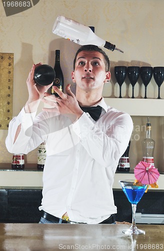 Image of pro barman prepare coctail drink on party