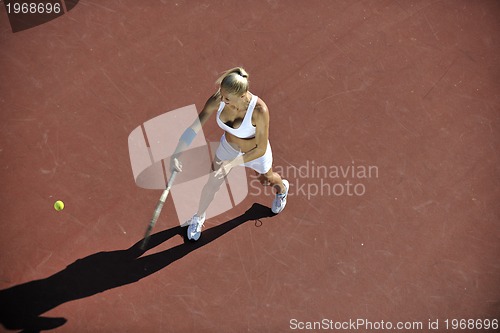 Image of young woman play tennis outdoor