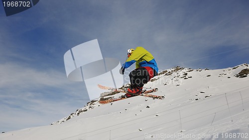 Image of happy young man have fun at winter on mountain peak