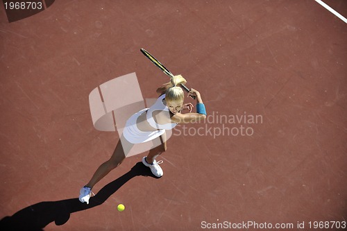 Image of young woman play tennis outdoor
