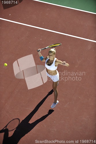 Image of young woman play tennis outdoor