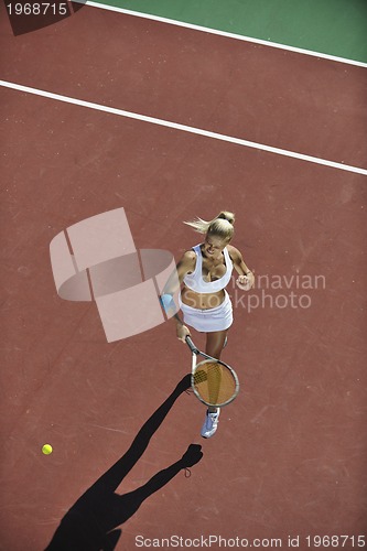 Image of young woman play tennis