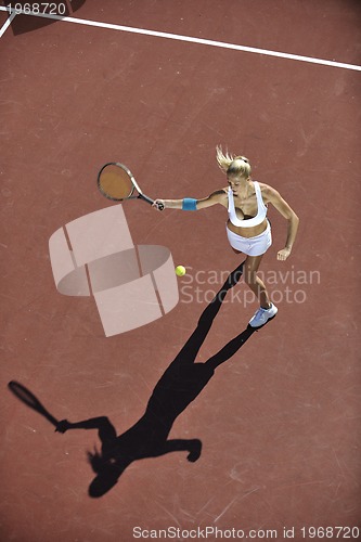 Image of young woman play tennis outdoor