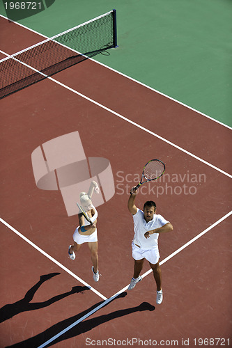 Image of happy young couple play tennis game outdoor