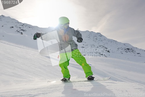 Image of happy young man have fun at winter on mountain peak