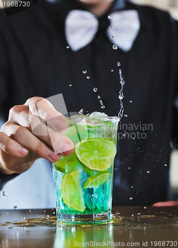 Image of pro barman prepare coctail drink on party