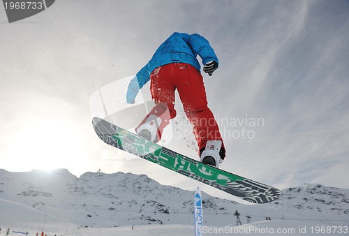 Image of snowboarder extreme jump