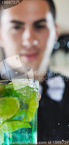 Image of pro barman prepare coctail drink on party