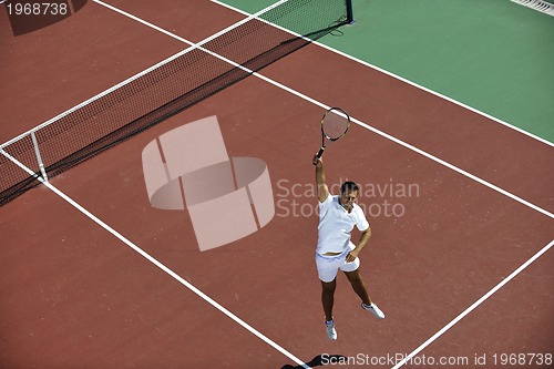 Image of young man play tennis