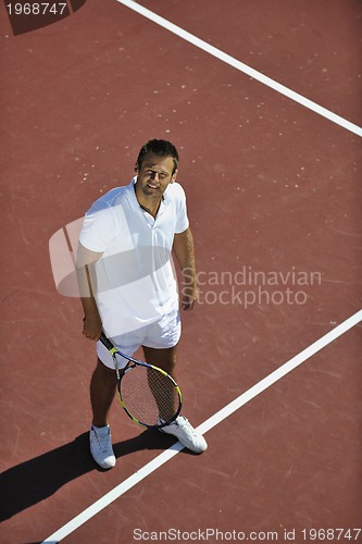 Image of young man play tennis