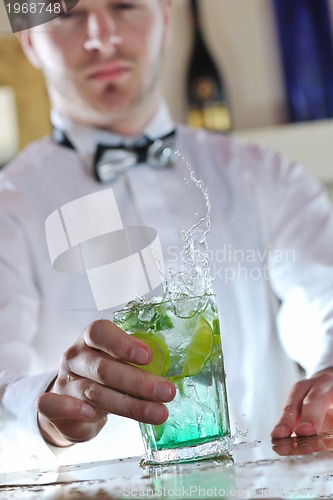 Image of pro barman prepare coctail drink on party