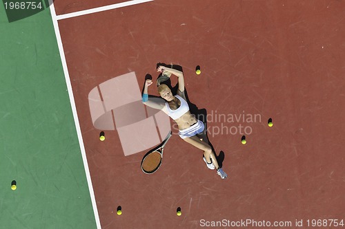 Image of young woman play tennis outdoor