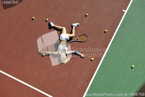 Image of young woman play tennis outdoor