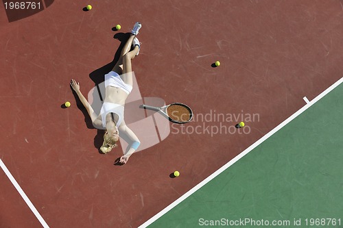 Image of young woman play tennis outdoor