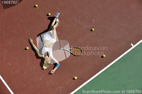 Image of young woman play tennis outdoor