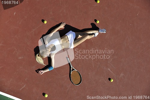 Image of young woman play tennis outdoor