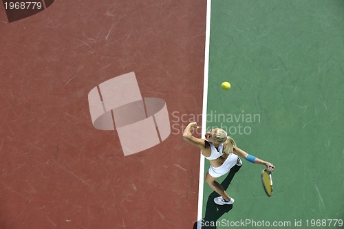 Image of young woman play tennis outdoor