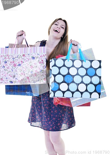 Image of happy young adult women  shopping with colored bags