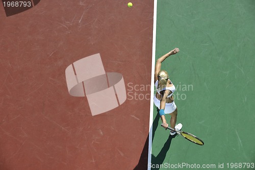 Image of young woman play tennis outdoor