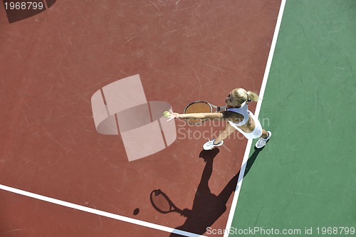 Image of young woman play tennis outdoor