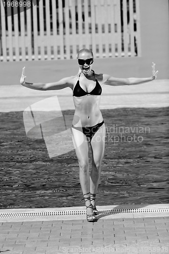 Image of beautiful woman relax on swimming pool