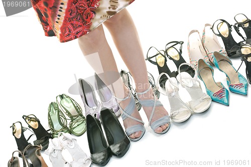 Image of pretty young woman with buying shoes addiction, isolated on whit