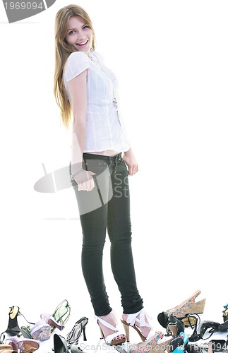 Image of pretty young woman with buying shoes addiction, isolated on whit