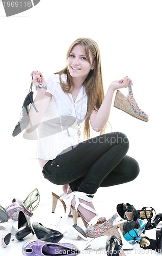 Image of pretty young woman with buying shoes addiction, isolated on whit