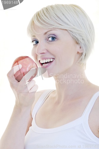 Image of happy  young  woman eat green apple isolated  on white