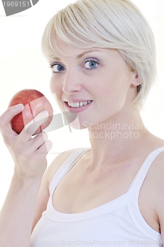 Image of happy  young  woman eat green apple isolated  on white