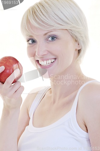 Image of happy  young  woman eat green apple isolated  on white