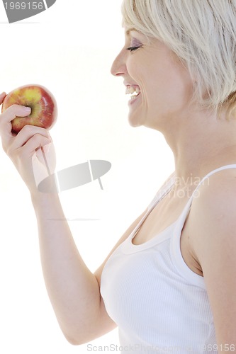 Image of happy  young  woman eat green apple isolated  on white