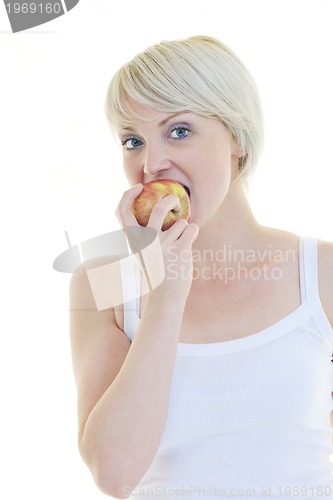 Image of happy  young  woman eat green apple isolated  on white