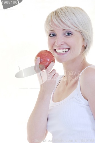 Image of happy  young  woman eat green apple isolated  on white