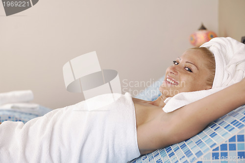 Image of woman relaxing at spa and wellness