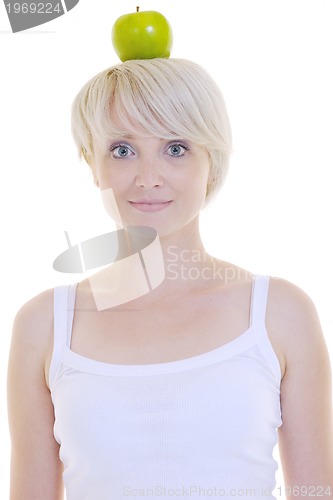 Image of happy  young  woman eat green apple isolated  on white