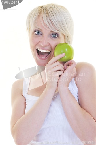 Image of happy  young  woman eat green apple isolated  on white