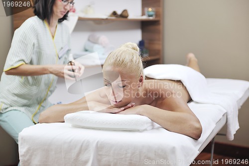 Image of woman back massage treatment