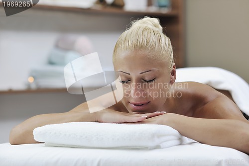 Image of woman at spa and wellness back massage